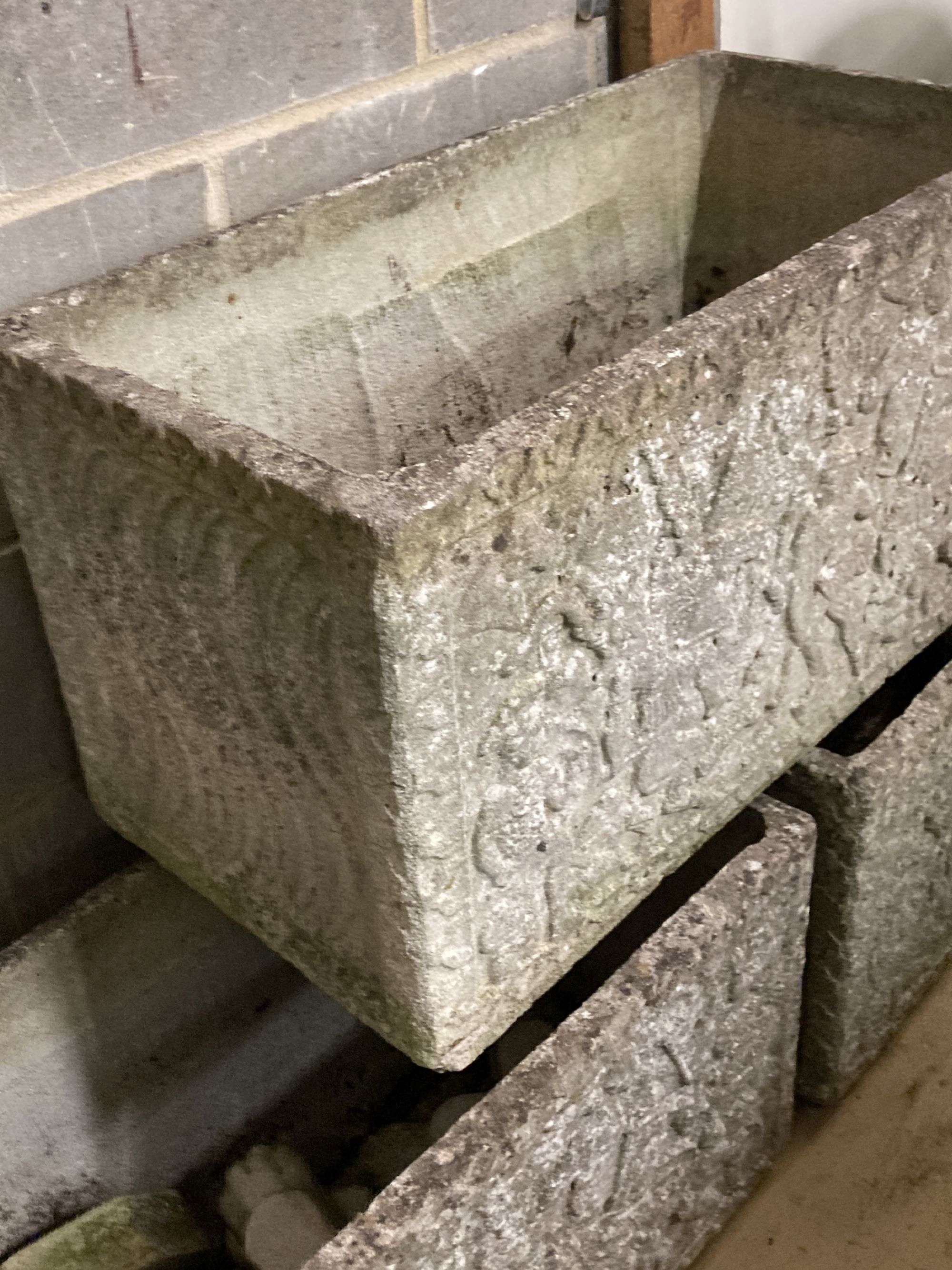 A set of three reconstituted stone rectangular garden planters with claw feet, width 77cm, depth 39cm, height 44cm